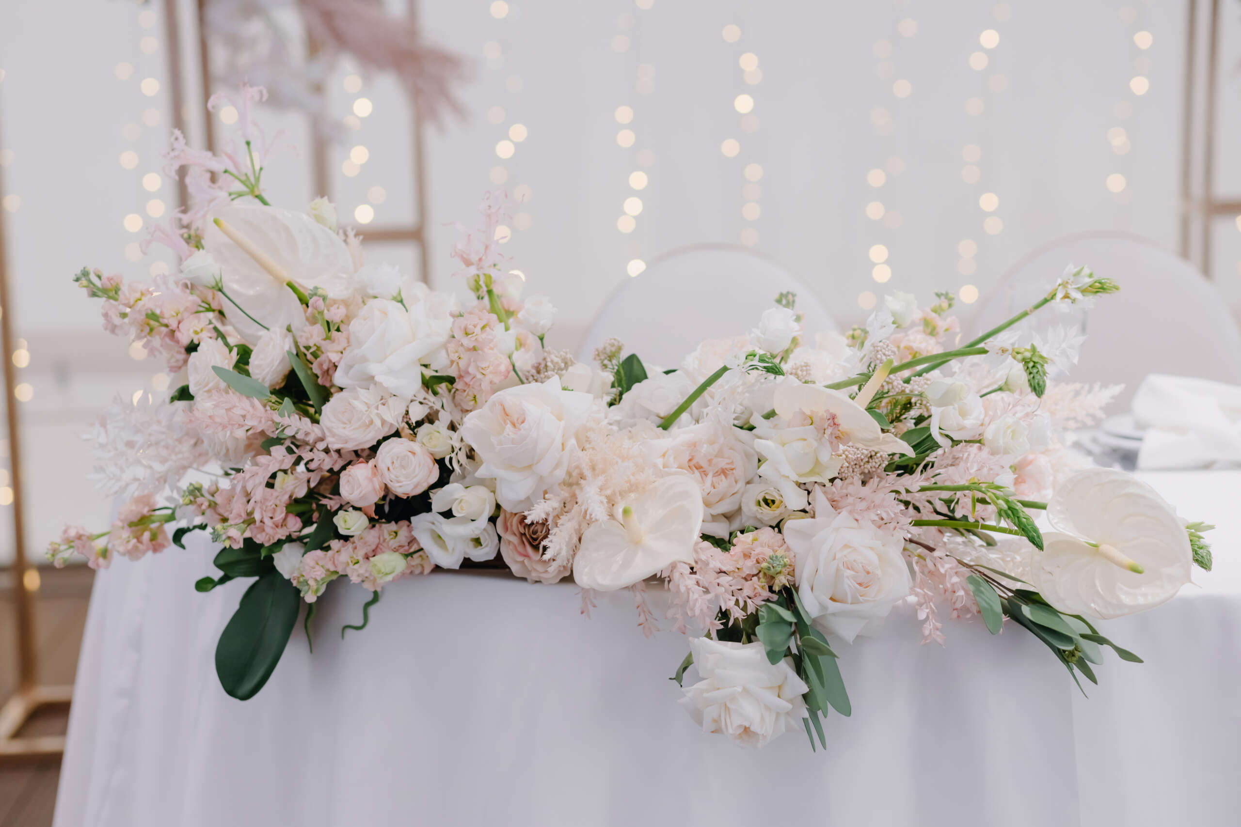 festive tables decorated with compositions of flowers and greenery